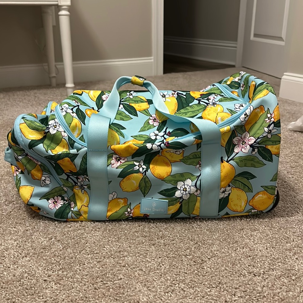 Vera Bradley lemon print rolling duffel bag. NEVER used!!